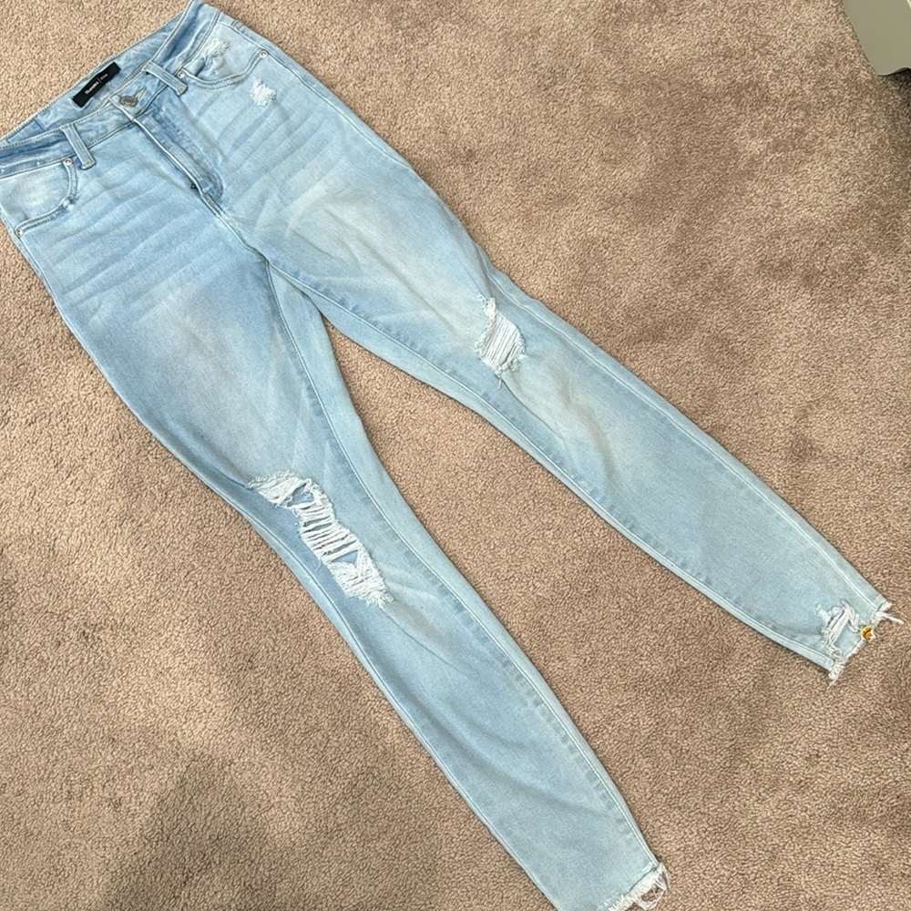 Light wash denim distressed skinny jeans